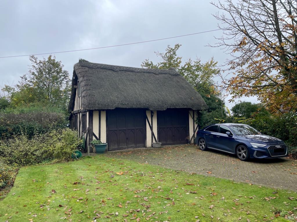 Lot: 31 - A DETACHED THATCHED COTTAGE FOR IMPROVEMENT AND REPAIR - Double Garage block with room above